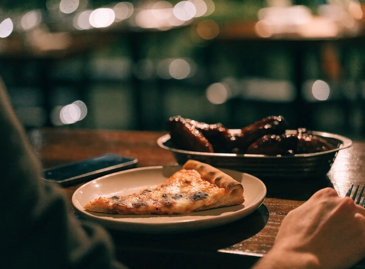 Table for two with pizza during an evening visit